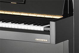 Clavier de piano droit noir, marque C. Bechstein.